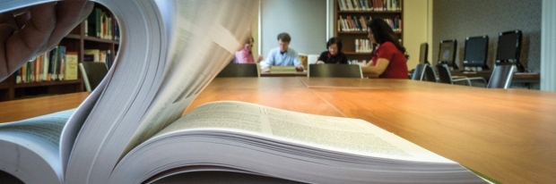 Close-up of book on a long table