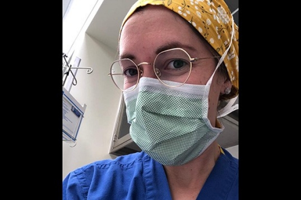 Carlie Aubaugh. MD, in blue scrubs top and surgical mask